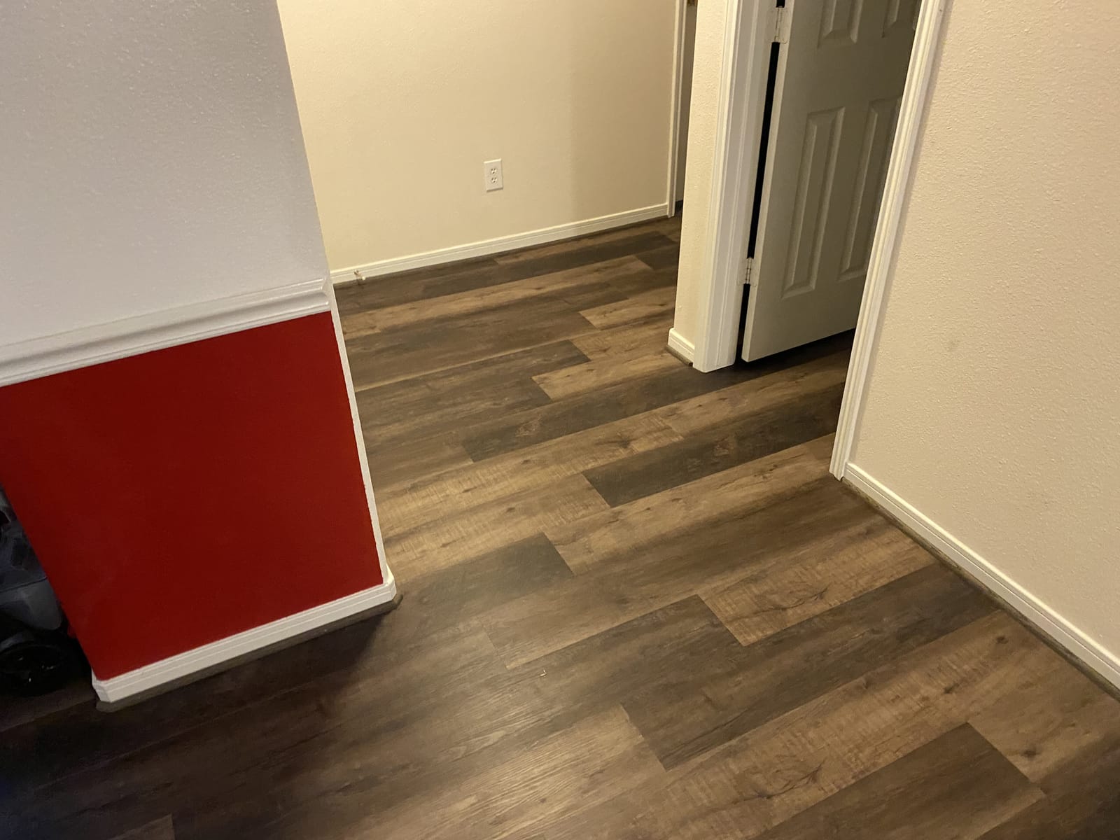 Wood-look luxury vinyl plank installed across an open Houston-area floor plan